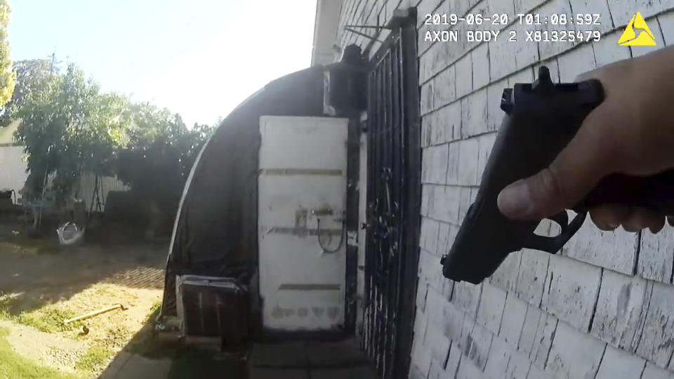 This still image taken from bodycam video released by the Sacramento Police Dept. shows the Wednesday, June 22, 2019 confrontation where a rookie Sacramento police officer was ambushed by a gunman in Sacramento, Calif. Tara O'Sullivan, 26, was shot several times and one of the wounds was "non-survivable," Sgt. Vance Chandler said at a late-night news conference. Adel Sambrano Ramos, 45, was charged with murder, the attempted murder of a fellow officer, and possessing two illegal assault rifles. (Sacramento Police Dept. via AP)