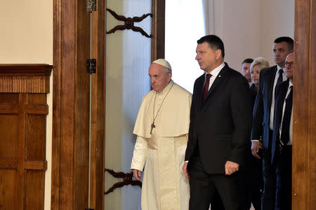 Pope Francis and Latvian President Raimonds Vejonis attend a meeting at the Presidential Palace in Riga, Latvia, during the second leg of Pope Francis' trip to the Baltic states September 24, 2018. Vatican Media/Handout via REUTERS