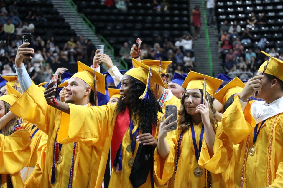 Moody High School graduates celebrate during the school's commencement ceremony Friday, June 3, 2022, at the American Bank Center.