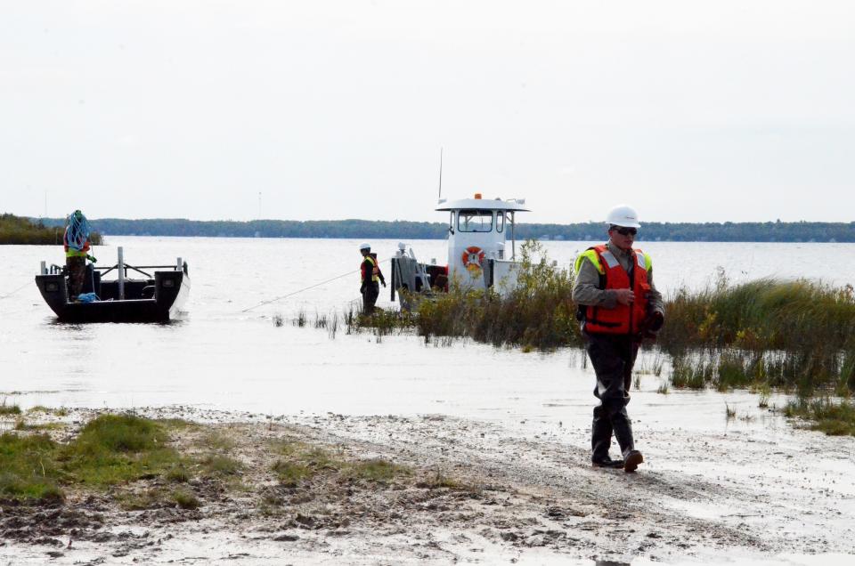 Enbridge personnel and other local agencies conduct an oil spill drill in the Straits of Mackinac in 2015.