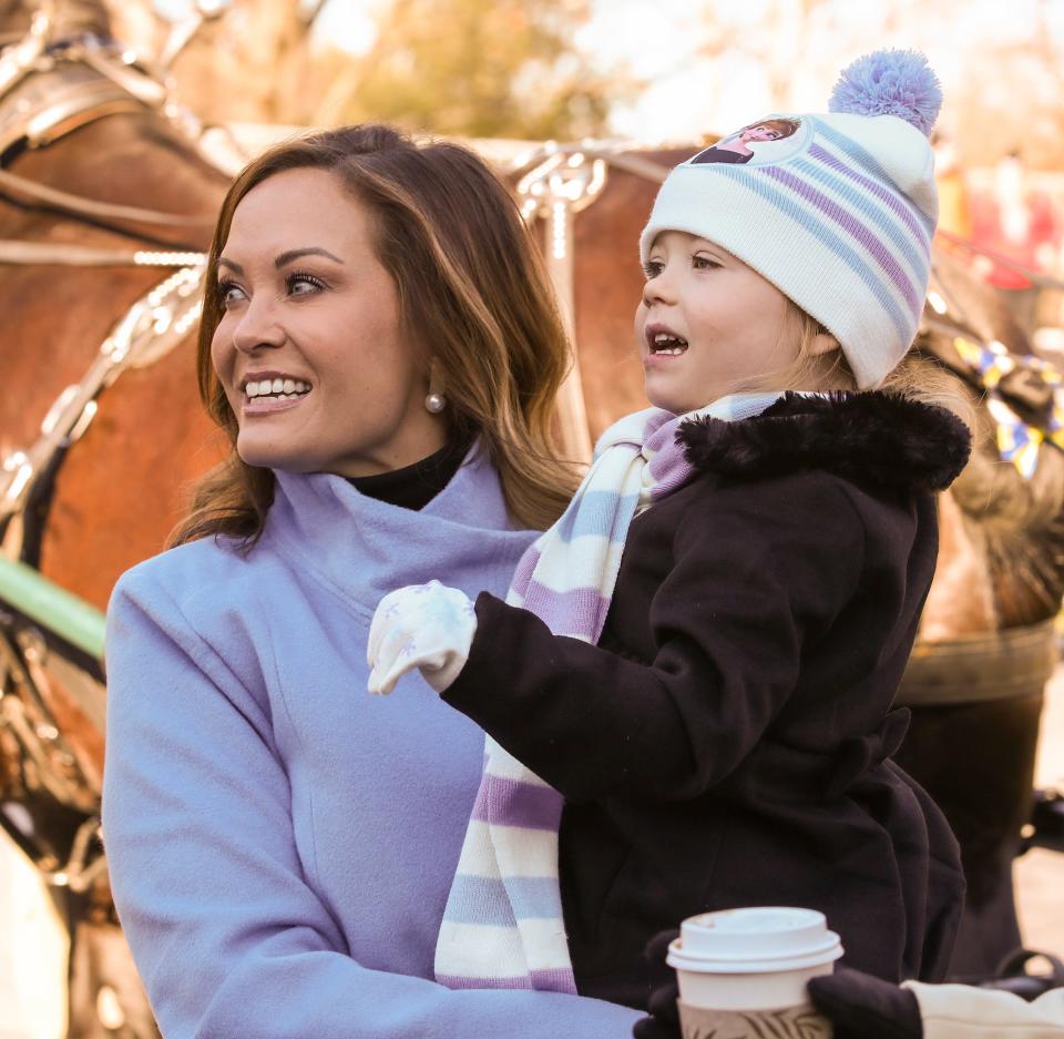 Lt. Governor Jacquelyn Coleman, and daughter, Evelynne, arrive at the review stand for the inaugural parade on Tuesday, December 12, 2023