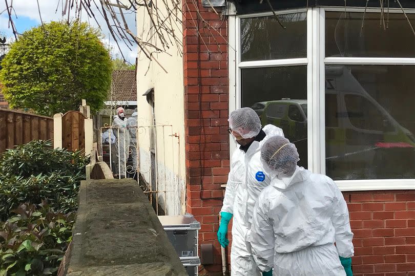 Scene of crime officers investigating the discovery of part of a torso search a house on Worsley Road in Winton -Credit:men