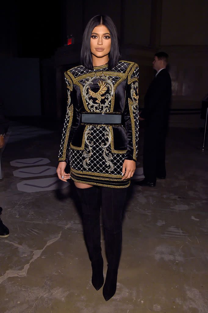 <p>Jenner wore a mini dress and boots by Balmain to the BALMAIN X H&M Collection Launch.</p>