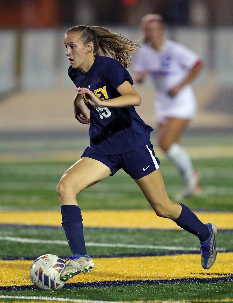 Copley's Kate Young takes the ball up the field against Revere during the second half Wednesday in Copley.