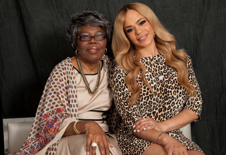 Voletta Wallace (left), pictured with Faith Evans, told Rolling Stone she wants to "slap the daylights" out of Sean "Diddy" Combs in a new interview.