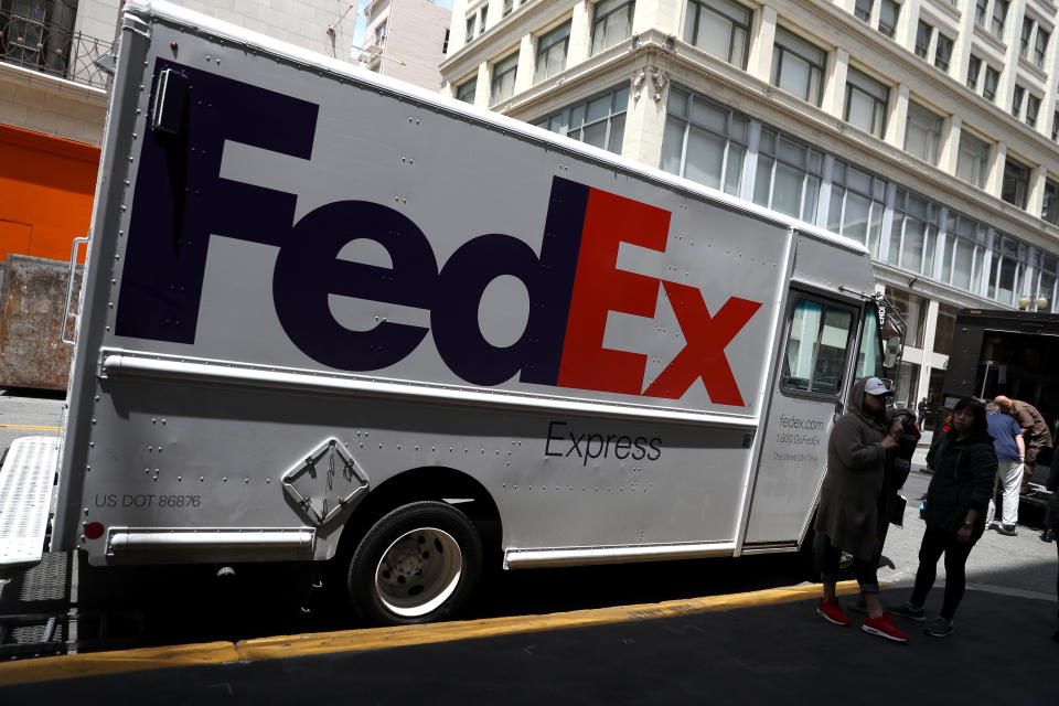 SAN FRANCISCO, CALIFORNIA - JUNE 25: A FedEx delivery truck sits parked on June 25, 2019 in San Francisco, California. FedEx is suing the US Department of Commerce for requiring the shipping company to implement extra screening efforts to enforce export bans. Due in part to the ongoing trade war with China and potential security threats, the U.S. government has imposed several restrictions on companies that deal with Chinese electronics company Huawei. (Photo by Justin Sullivan/Getty Images)