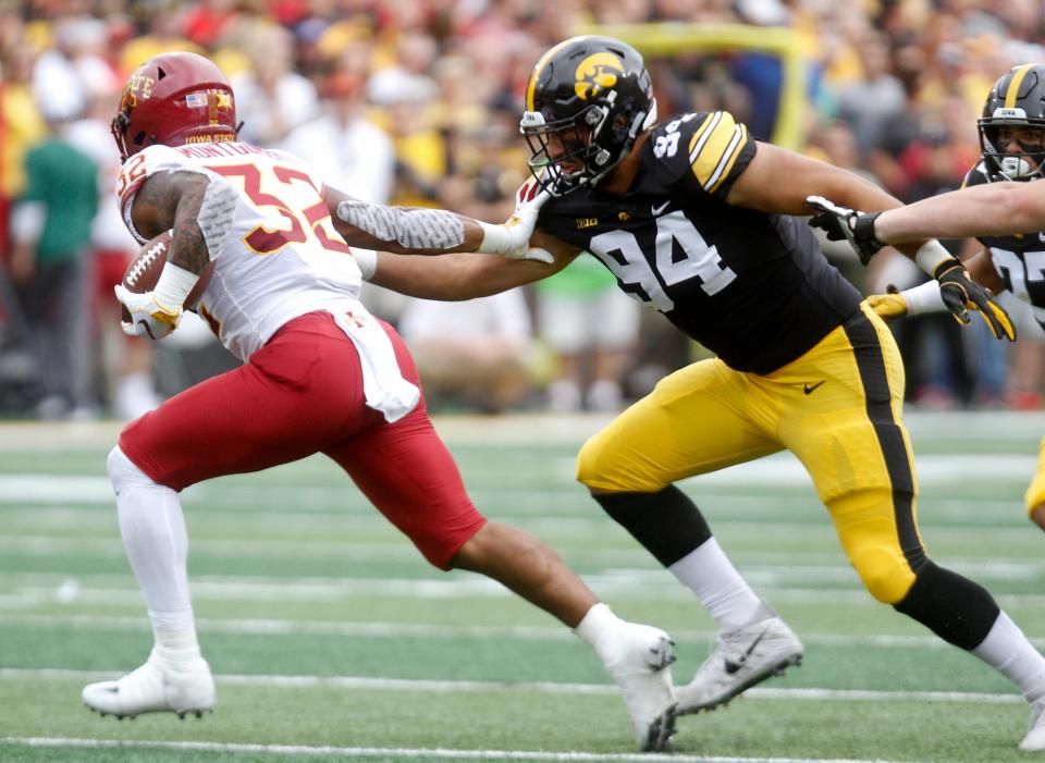 IOWA CITY, IOWA- SEPTEMBER 08:  Defensive end A.J. Epenesa #94 of the Iowa Hawkeyes gives chase to runningback David Montgomery #32 of the Iowa State Cyclones during the first half on September 8, 2018 at Kinnick Stadium, in Iowa City, Iowa.  (Photo by Matthew Holst/Getty Images)