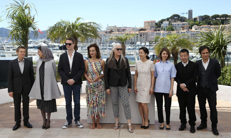 President of the jury Jane Campion, center, poses with members of the jury from left, Willem Dafoe, Leila Hatami, Nicolas Winding Refn, Carole Bouquet, Jeon Do-yeon, Sofia Coppola, Jia Zhangke and Gael Garcia Bernal pose for photographers during a photo call for members of the jury at the 67th international film festival, Cannes, southern France, Wednesday, May 14, 2014. (AP Photo/Alastair Grant)