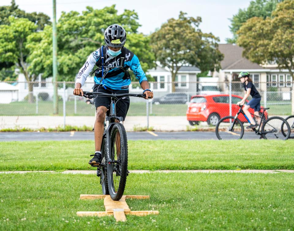 Aaron Lewis, a junior at MacDowell Montessori School, practices some drills on the balance beam at an MKE MTB practice on Thursday, July 21, 2022.