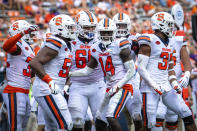 Syracuse defensive back Garrett Williams (14) celebrates with his teammates after intercepting a pass during an NCAA college football game against Clemson in Clemson, S.C., on Saturday, Oct. 24, 2020. (Ken Ruinard/Pool Photo via AP)