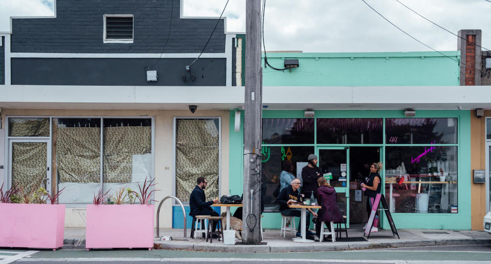 Residents sit outside a cafe in Moreland City Council, Victoria. Source: Moreland City Council