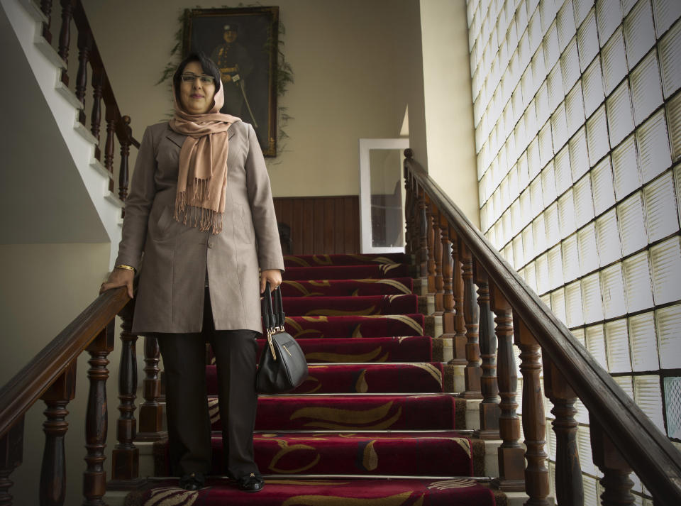 In this Wednesday, March 26, 2014 photo, Afghan lawmaker Lailoma Wali Hakimi from Nangarhar poses in the staircase in the parliament in Kabul, Afghanistan. When the Taliban ruled, women rarely left their home. When they did venture beyond their four walls, they wafted through crowded markets covered from head to toe in the all-encompassing burqa. While most women in conservative Afghanistan may still wear the burqa, today’s Afghan woman has choices she never had before, like running for parliament. (AP Photo/Anja Niedringhaus)