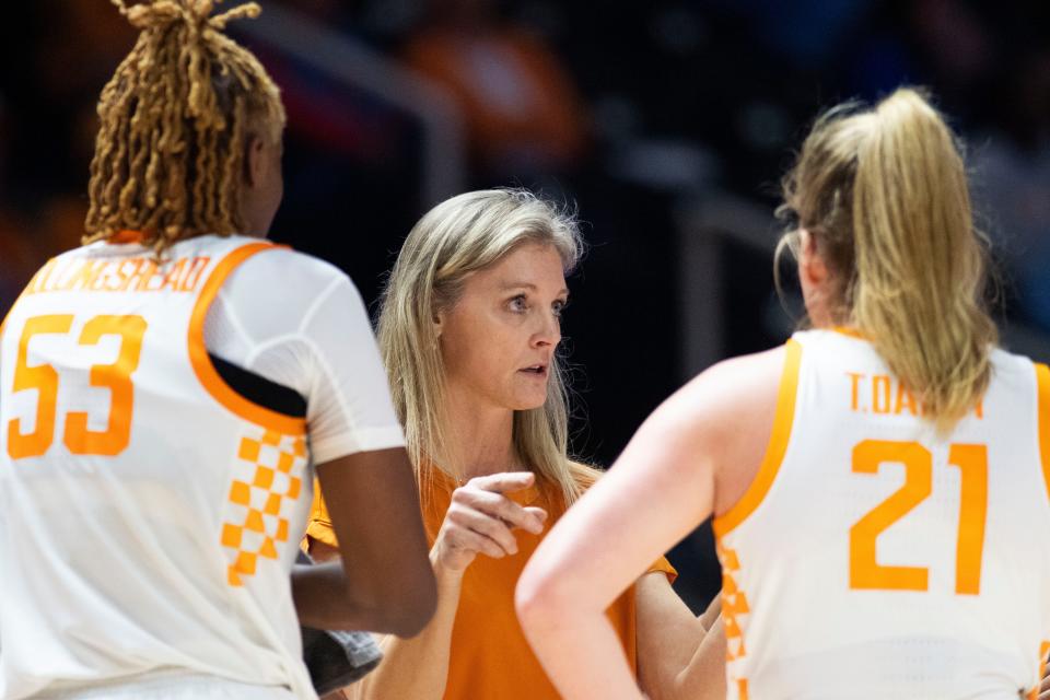 Tennessee's head Lady Vols' basketball coach Kellie Harper speaks to forward Jillian Hollingshead (53) and Tess Darby (21) during a time-out during a NCAA basketball game against the Memphis Tigers at the Food City Center at Thompson-Boling Arena on Monday, Nov. 13, 2023.