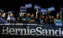 Supporters of Democratic presidential candidate Sen. Bernie Sanders, I-Vt., cheer as they watch results of the Nevada Cacus during a campaign event in San Antonio, Saturday, Feb. 22, 2020. (AP Photo/Eric Gay)