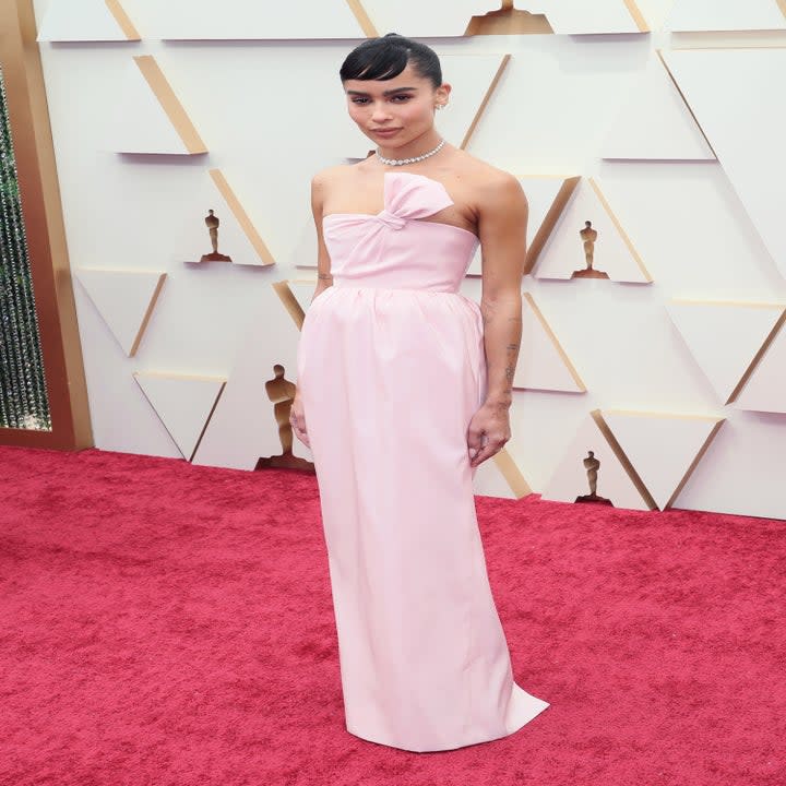 Zoë wears a strapless gown on the Oscars red carpet