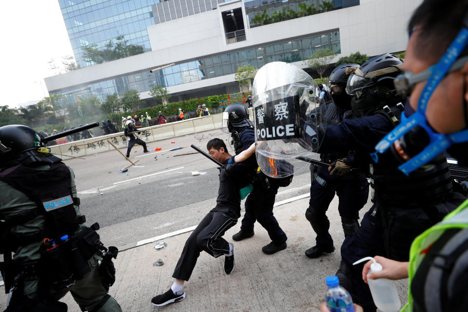 Riot police detain a demonstrator as they clash during a protest in Hong Kong, August 24, 2019.&nbsp; (Photo: Kai Pfaffenbach/Reuters)