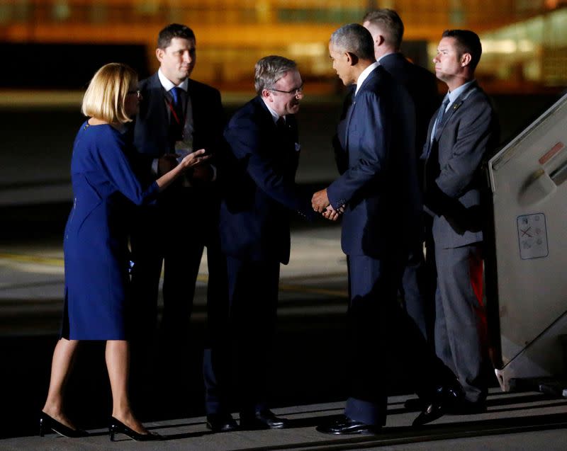 FILE PHOTO: Polish presidential aide Krzysztof Szczerski greets then U.S. President Barack Obama as he arrives in Poland for a NATO Summit in 2016