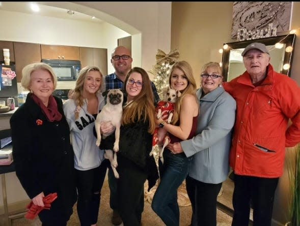 Kathy Castro, left, stands with her family, from left: niece Skyler, nephew TJ and his wife, Makaela, niece Britt, sister-in-law Pat and brother Tom.