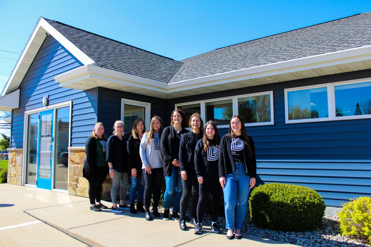 Big Brothers Big Sisters staff celebrate their impending move to a bigger space. They are, from left, Jennifer Smith, Tammy Young, Amy Docter, Jennifer Serrano, Sara Straub, Lisa Warntjes, Jill Petersen and Jennifer Leu.
