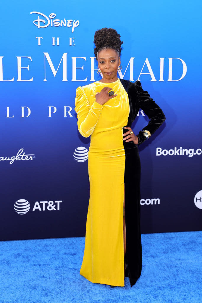 Closeup of Noma Dumezweni in a two-toned velvet dress