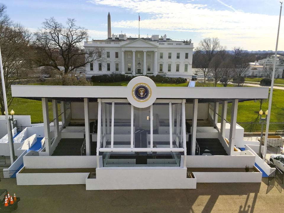 The inaugural parade presidential reviewing stand on Pennsylvania Avenue in front of the White House, Sunday, Jan. 15, 2017, is nearly completed in preparation for the 58th presidential inauguration, on Friday, Jan. 20. (AP Photo/Pablo Martinez Monsivais)