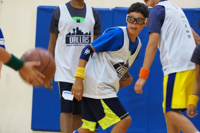 <p>Courtesy Canales Family</p> Gray Canales at basketball camp at 13 years old