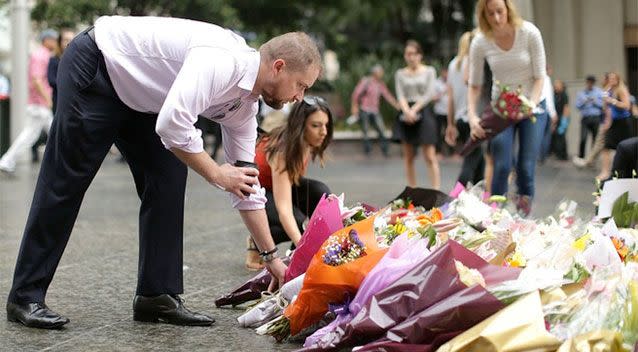 Flowers are left as a sign of respect at Martin Place on December 16, 2014 in Sydney, Australia. (Photo by Mark Metcalfe/Getty Images)