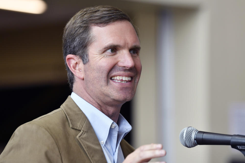 Kentucky governor and Democratic candidate for re-election Andy Beshear speaks to supporters during a stop of his statewide bus tour in Owensboro, Ky., Friday, May 19, 2023. (AP Photo/Timothy D. Easley)