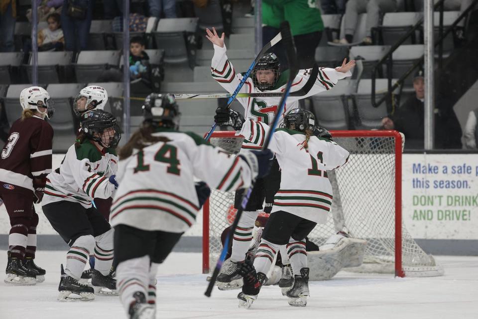 SCMB hockey celebrates winning the state girls hockey championship.