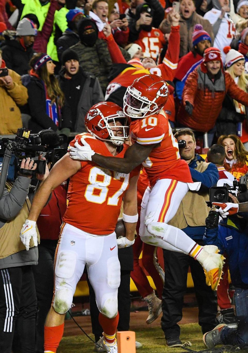 Kansas City Chiefs wide receiver Tyreek Hill celebrates tight end Travis Kelce’s game-winning touchdown in overtime of the AFC Divisional Playoff game against the Buffalo Bills at GEHA Field at Arrowhead Stadium Sunday, Dec. 23, 2022. The Chiefs beat the Bills in 42-36.