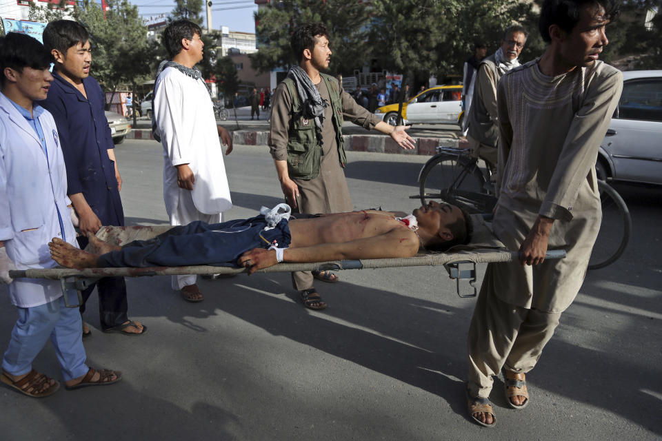 A man injured in a deadly suicide bombing that targeted a training class in a private building in the Shiite neighborhood of Dasht-i Barcha, in western Kabul, Afghanistan, Wednesday, Aug. 15, 2018. The public Health Ministry said the casualty toll has risen to at least 48 dead and dozens wounded. (AP Photo/Rahmat Gul)