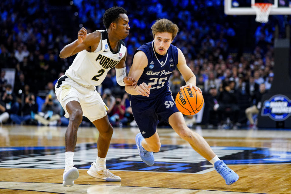 Saint Peter’s Doug Edert against Purdue’s Eric Hunter Jr. during the second half of a college basketball game in the Sweet 16 round of the NCAA tournament. - Credit: AP