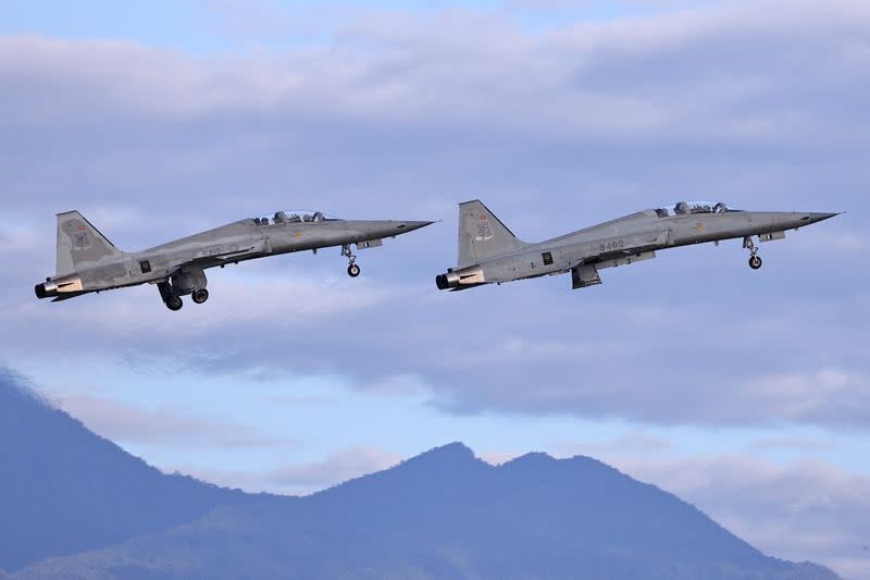 Two F-5 fighter jets are seen during practice at Chihhang Air Base in Taitung