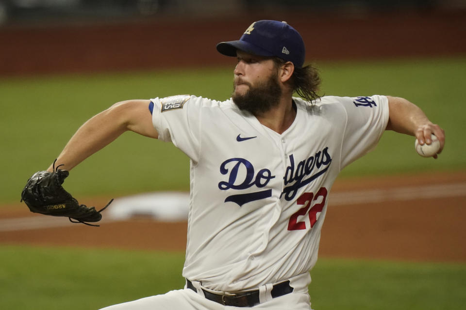 Los Angeles Dodgers starting pitcher Clayton Kershaw throws against the Tampa Bay Rays during the first inning in Game 1 of the baseball World Series Tuesday, Oct. 20, 2020, in Arlington, Texas. (AP Photo/Eric Gay)