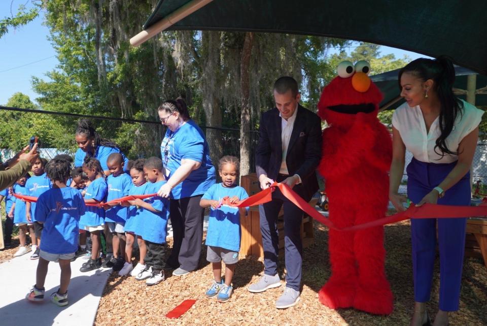 Officials from Episcopal Children’s Services' site on Waldo Road in NE Gainesville and PNC Foundation join children of the center during the ribbon-cutting ceremony for the newly installed “STEAM Ahead with Outdoor Learning” area that was funded by a $56,000 grant from PNC Foundation through PNC’s signature philanthropic initiative called PNC Grow Up Great.
(Credit: Photo provided by Voleer Thomas)
revising Image