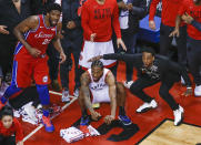 TORONTO, ON - MAY 12: Philadelphia 76ers center Joel Embiid (21) watches from the corner as Toronto Raptors forward Kawhi Leonard (2) squats down and sticks out his tongue waiting for the ball to drop for Raptors to win. Toronto Raptors vs Philadelphia 76ers in2nd half action of Round 2, Game 7 of NBA playoff play at Scotiabank Arena. . Toronto Star/Rick Madonik (Rick Madonik/Toronto Star via Getty Images)