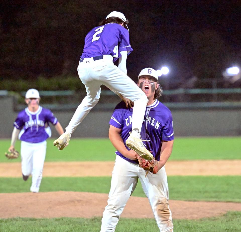 BROCKTON  06/13/23    Bourne closer Luca Finton is joined by his teammate Jacob Lewis (2) after the last out against  Ayer Shirley in a 7-5 win in the  Division 5 semifinal baseball game