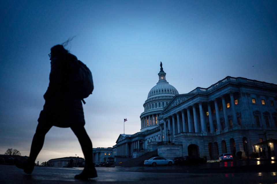 A pedestrian walks through the Capitol Plaza (Kent Nishimura / Los Angeles Times via Getty Images file)