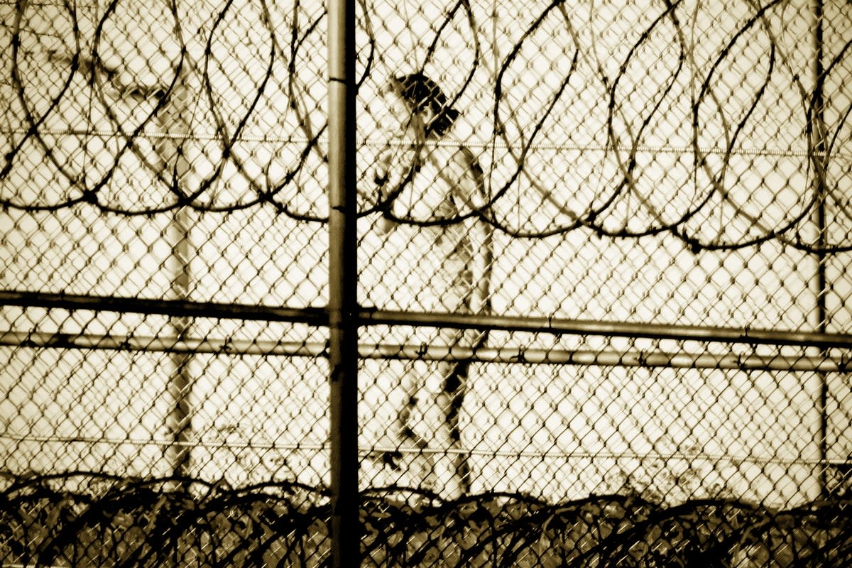 Convicted sex trafficker Ghislaine Maxwell, pictured exercising inside the fences of her Tallahassee prison, is serving a 20-year sentence (Matt Symons/Mirrorpix)