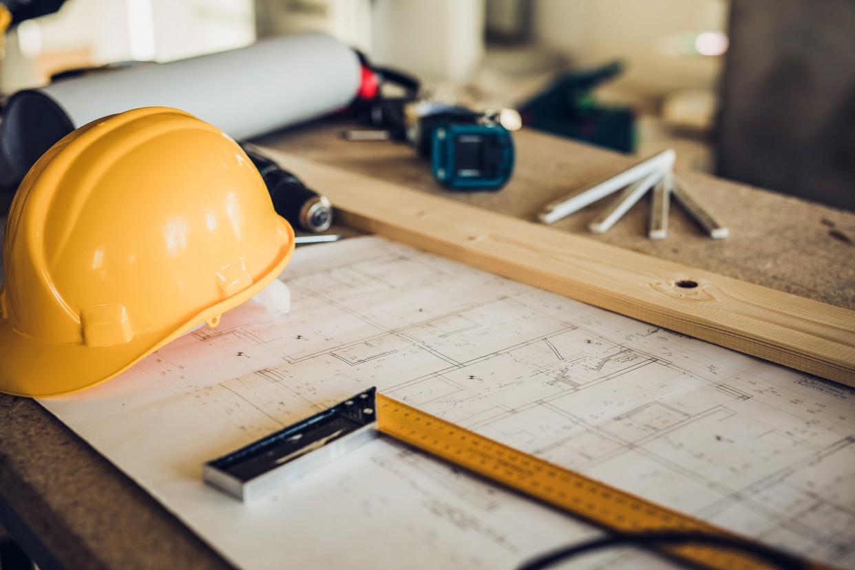 closeup of construction worker's equipment on bench at construction site without people