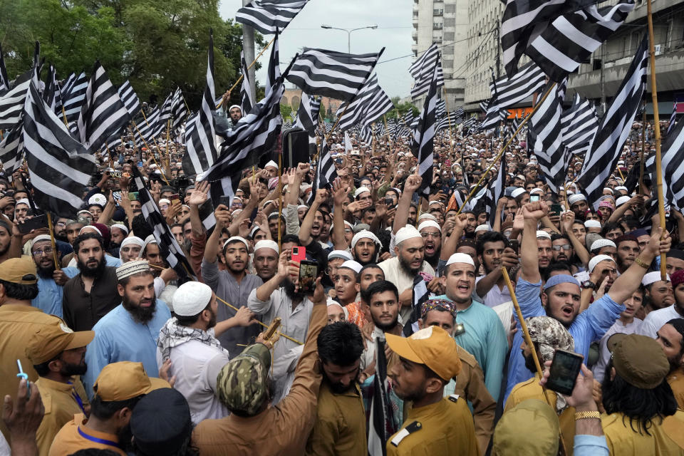 Supporters of a religious group 'Jamiat Ulema-e-Islam-F' party chant slogans during a rally to denounce the burning of Islam's holy book 'Quran,' in Sweden in Karachi, Pakistan, Sunday, July 23, 2023. (AP Photo/Fareed Khan)