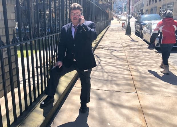 Lands and Forestry Minister Chuck Porter stands outside Province House in Halifax on Thursday after announcing he will not seek re-election. (Jean Laroche/CBC - image credit)