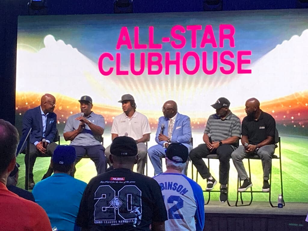 From left, Seattle Mariners announcer Dave Sims, retired All-Stars Andre Dawson and Tim Raines, Negro Leagues Museum president Bob Kendrick, former All-Stars Edwin Jackson and Jimmy Rollins pose for fans after a panel, Monday, July 18, 2022, on the life and legacy of Jackie Robinson in Los Angeles. (AP Photo/ Beth Harris)