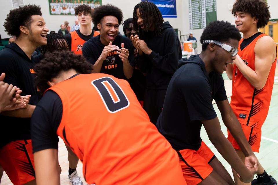 Central York players including Adzmir Ludvig (far left)dance with their teammates before the start of a non-league basketball game against Central Dauphin Jan. 22, 2024, in Harrisburg. The Panthers won, 74-71.