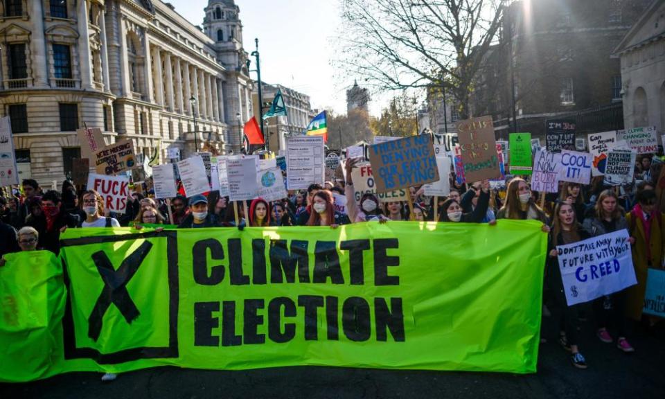 Students march in a “Fridays for Future” climate strike on 29 November in London.