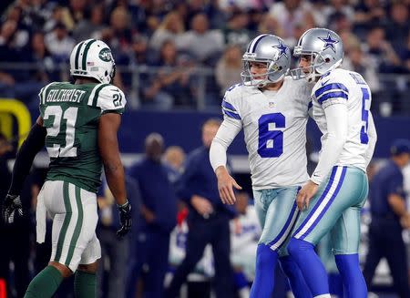 Dec 19, 2015; Arlington, TX, USA; Dallas Cowboys kicker Dan Bailey (5) celebrates with punter Chris Jones (6) after kicking a field goal during the game against the New York Jets at AT&T Stadium. Mandatory Credit: Kevin Jairaj-USA TODAY Sports