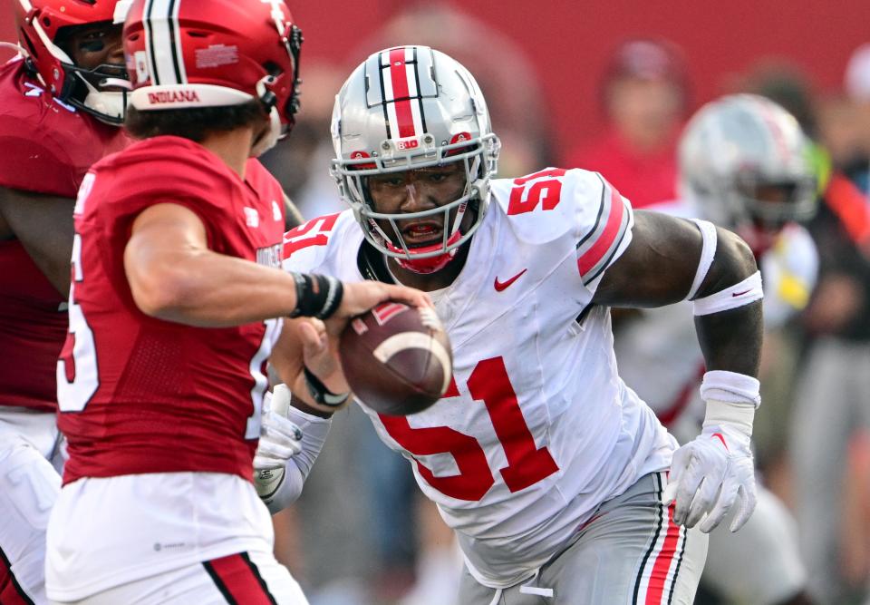 Sep 2, 2023; Bloomington, Indiana, USA; Ohio State Buckeyes defensive tackle Michael Hall Jr. (51) attempts to sack Indiana Hoosiers quarterback Brendan Sorsby (15) before a pass during the second half at Memorial Stadium. Mandatory Credit: Marc Lebryk-USA TODAY Sports