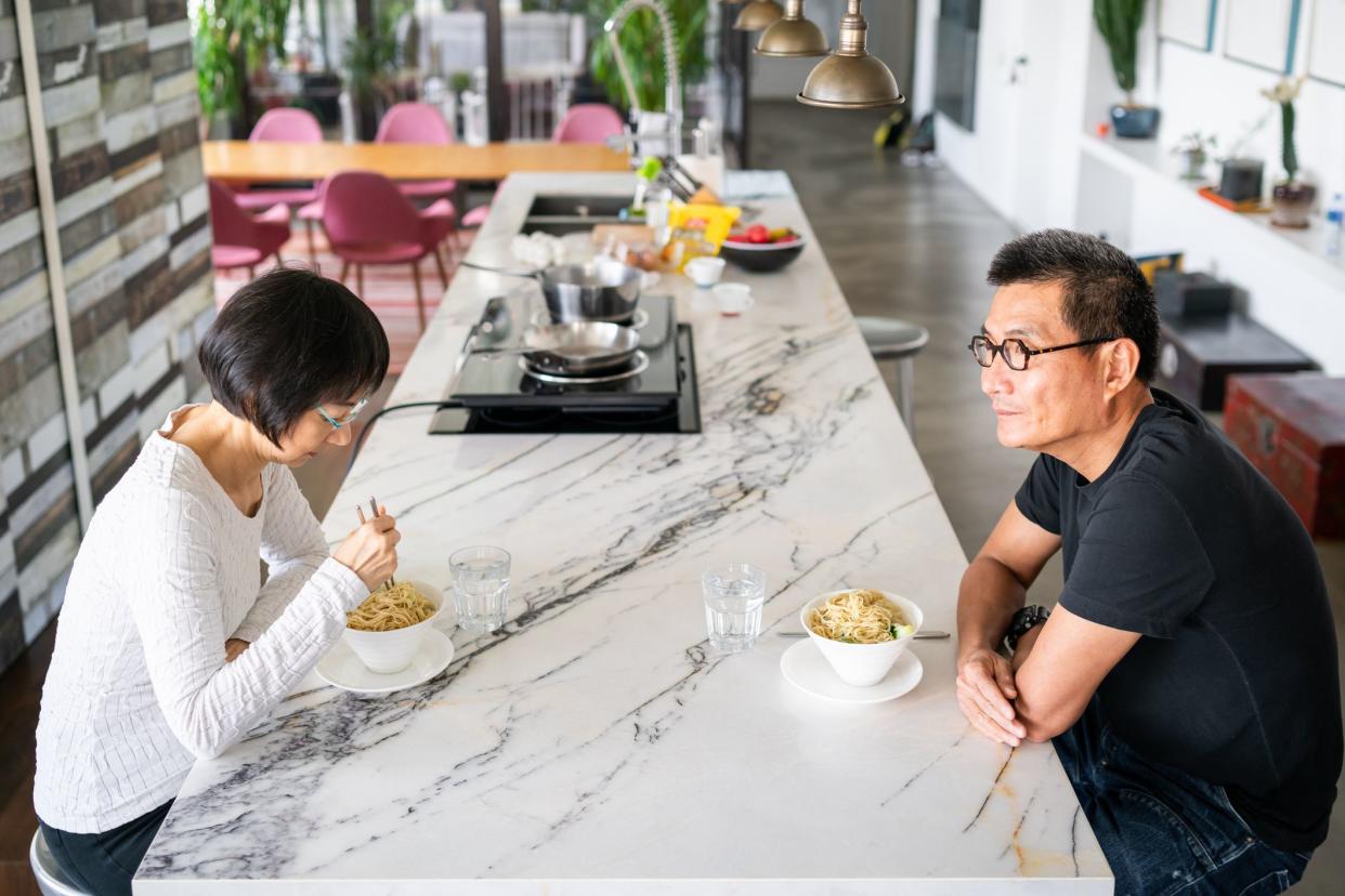 couple eating not talking to each other