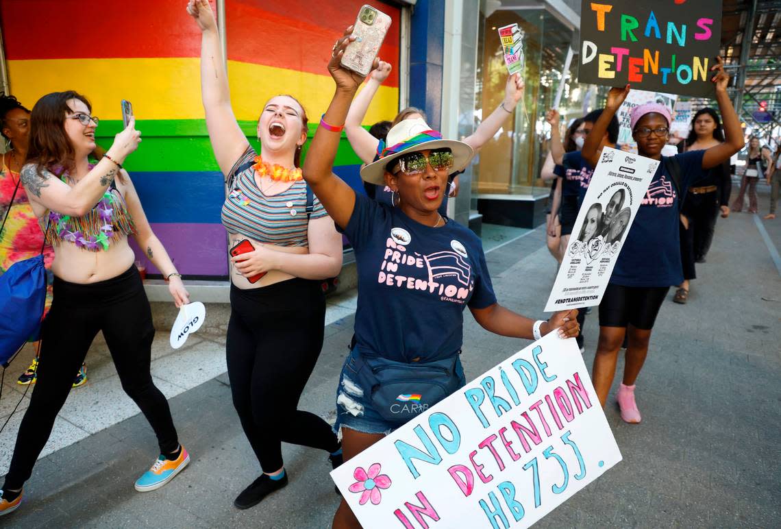 Tania Jiménez, 39, of Asheboro, center, participates in a march in downtown Raleigh, N.C., Saturday June 25, 2022, to protest House Bill 755, the “Parents’ Bill of Rights,” and bring awareness to the conditions trans immigrants face in detention.