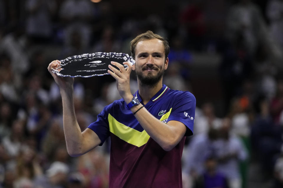 Daniil Medvedev, of Russia, poses for photographs after losing to Novak Djokovic, of Serbia, in the men's singles final of the U.S. Open tennis championships, Sunday, Sept. 10, 2023, in New York. (AP Photo/Frank Franklin II)